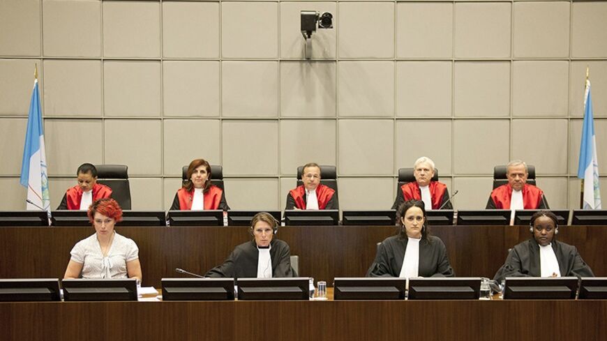 Judges of the U.N. Special Tribunal for Lebanon (STL) (back row, L to R) Janet Nosworthy, Micheline Braidi, Robert Roth, David Re and Walid Akoum attend the opening of the public hearing at the court in Leidschendam, near The Hague June 13, 2012. The Lebanon tribunal held the hearing to decide whether it has jurisdiction to try those responsible for the assassination of Lebanese prime minister in 2005. The defence teams of the four suspects challenged the legality of the tribunal. REUTERS/Robert Vos/Pool (N