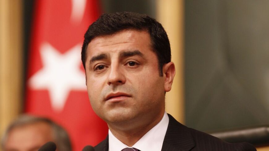 Peace and Democracy Party (BDP) Co-chairman Selahattin Demirtas addresses members of the parliament from his party and audience members during a meeting at theTurkish parliament in Ankara January 8, 2013.   REUTERS/Umit Bektas (TURKEY - Tags: POLITICS) - RTR3C7GS