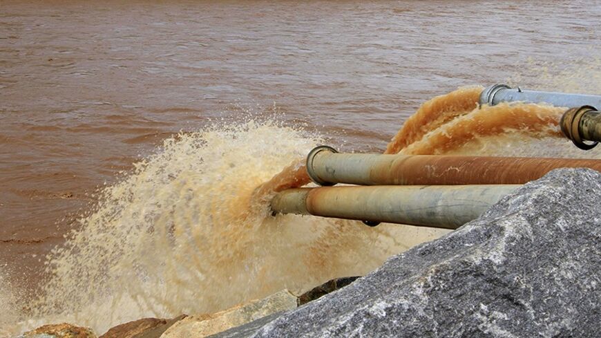 Water gushes out from pipes by the construction of Ethiopia's Great Renaissance Dam in Guba Woreda, some 40 km (25 miles) from Ethiopia's border with Sudan, June 28, 2013. Egypt fears the $4.7 billion dam, that the Horn of Africa nation is building on the Nile, will reduce a water supply vital for its 84 million people, who mostly live in the Nile valley and delta. Picture taken June 28, 2013. REUTERS/Tiksa Negeri (ETHIOPIA - Tags: POLITICS SOCIETY ENERGY ENVIRONMENT) - RTX115KE