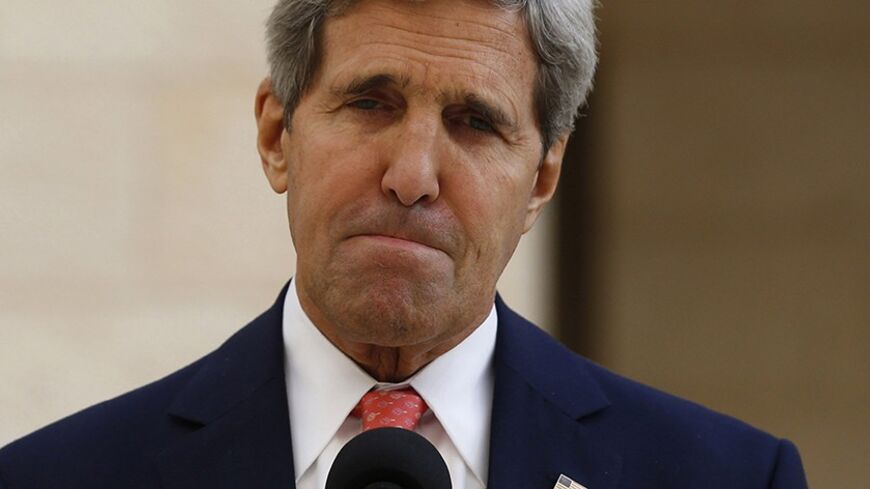 U.S. Secretary of State John Kerry reacts following his meeting with Palestinian Authority President Mahmoud Abbas in Bethlehem, November 6, 2013. Kerry urged Israel on Wednesday to limit settlement building in occupied territories to help push peace talks with the Palestinians back on track. REUTERS/Jason Reed   (WEST BANK - Tags: POLITICS) - RTX152FN