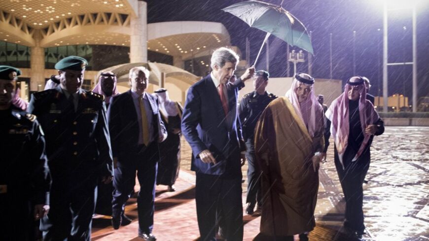 U.S. Secretary of State John Kerry walks to his plane with Saudi Minister of Foreign Affairs Prince Saud al-Faisal bin Abdulaziz al-Saud at King Khalid International Airport in Riyadh January 5, 2014. REUTERS/Brendan Smialowski/Pool (SAUDI ARABIA - Tags: POLITICS ROYALS) - RTX1738Z