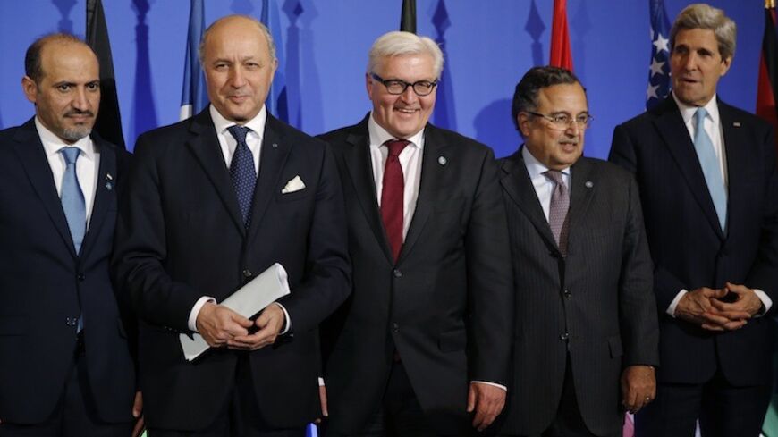 Ahmad Jarba, leader of Syria's opposition National Coalition (L-R), French Foreign Affairs Minister Laurent Fabius, German Foreign Minister Frank-Walter Steinmeier, Egypt's Foreign Minister Nabil Fahmy and U.S. Secretary of State John Kerry attend a news conference at the French foreign ministry during a "Friends of Syria" meeting ahead of Geneva II peace talks, in Paris, January 12, 2014.  The "Friends of Syria", an alliance of mainly Western and Gulf Arab countries who oppose Syrian President Bashar al-As