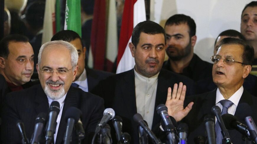 Iran's Foreign Minister Mohammad Javad Zarif (L) attends a joint conference with Lebanon's caretaker Foreign Minister Adnan Mansour in Beirut January 13, 2014. REUTERS/Mohamed Azakir (LEBANON - Tags: POLITICS) - RTX17CRS