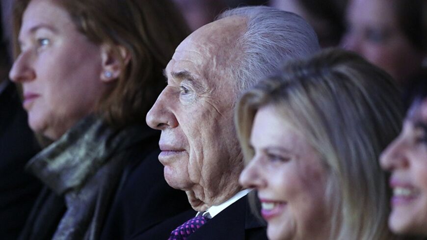 Israel's President Shimon Peres and the wife of Israel's Prime Minister Benjamin Netanyahu, Sara (R) attend a session at the annual meeting of the World Economic Forum (WEF) in Davos January 23, 2014.                       REUTERS/Ruben Sprich (SWITZERLAND  - Tags: POLITICS BUSINESS)   - RTX17RCB
