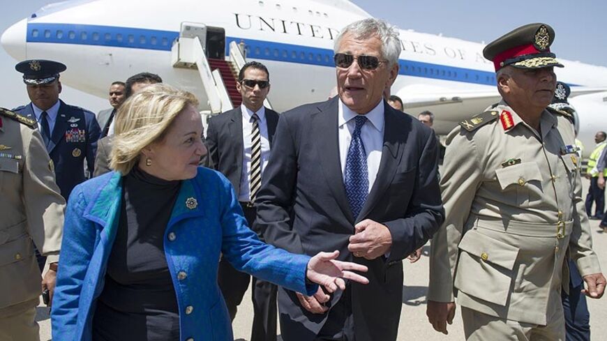 U.S. Defense Secretary Chuck Hagel (C) speaks with U.S. Ambassador to Egypt Anne Patterson and Egyptian Army Chief of Staff Major General Sedki Sobhi (R) upon his arrival in Cairo April 24, 2013.   REUTERS/Jim Watson/Pool   (EGYPT - Tags: POLITICS MILITARY) - RTXYY18