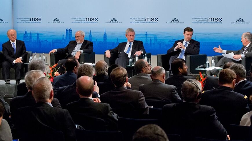 MUNICH, GERMANY - FEBRUARY 2:  (L-R) Director General of the International Atomic Energy Agency (IAEA) Yukiya Amano, Iranian Foreign Minister Mohammed Javad Zarif, Swedish Foreign Minister Carl Bildt, US Senator Christopher Murphy and chairman and organizer of the 50th Munich Security Conference (MSC)Wolfgang Ischinger attend a panel discussion during the 50th Munich Security Conference (MSC) in the Bayerischer Hof hotel on February 2, 2014 in Munich, Germany. The Munich Security Conference is to open with 