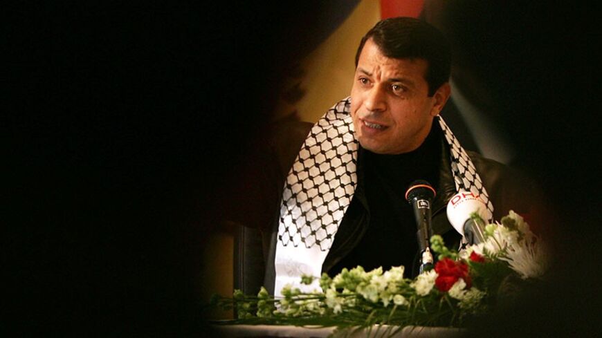 Fatah faction leader Mohammed Dahlan addresses the media during a news conference in the West Bank city of Ramallah January 15, 2006. Israel's cabinet on Sunday approved voting in Arab East Jerusalem in a January 25 Palestinian parliamentary election but said it would ban the militant Hamas group from listing its candidates on ballots there. REUTERS/Loay Abu Haykel - RTR1BTKM