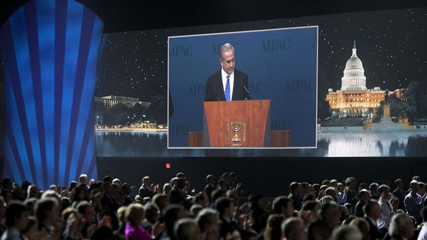 Israeli Prime Minister Benjamin Netanyahu is seen on a screen as he speaks at the American Israel Public Affairs Committee (AIPAC) policy conference in Washington March 5, 2012.      REUTERS/Joshua Roberts    (UNITED STATES - Tags: POLITICS) - RTR2YWD1