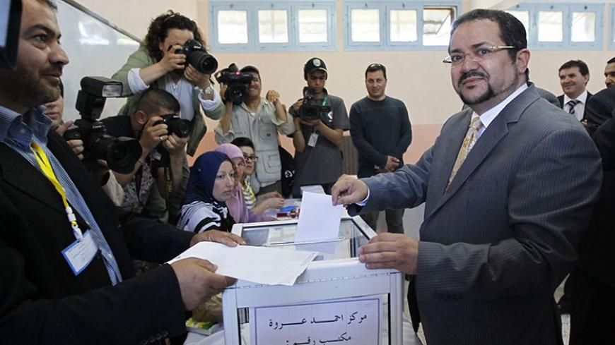 Abdelmadjid Menasra, leader of the Islamist party Front of Change (FC), casts his ballot during parliamentary elections at a polling station in Algiers May 10, 2012. Algerians voted on Thursday for a new parliament that officials say will bring democracy to a country left behind by the "Arab Spring" revolts, but many people showed their scepticism by abstaining. REUTERS/Louafi Larbi  (ALGERIA - Tags: POLITICS ELECTIONS) - RTR31UYV