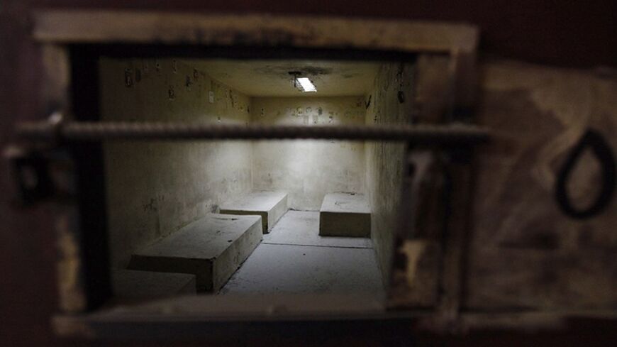 An empty cell is seen during a media tour arranged by the Iraqi authorities at a prison, known as Camp Honor, inside Baghdad's heavily-fortified Green Zone May 17, 2012.  Human Rights Watch said on Tuesday Iraqi authorities were still running a jail they said had been shut over a year ago after reports of prisoners being beaten and electrocuted, but the government denied this, saying the site was empty.    REUTERS/Mohammed Ameen (IRAQ - Tags: CRIME LAW) - RTR3272R