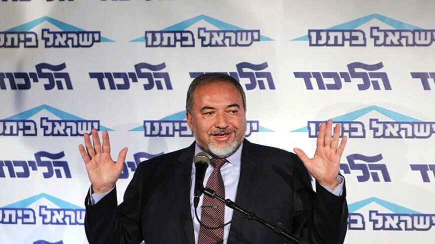 Israeli Foreign Minister Avigdor Lieberman gestures as he speaks at a conference for young members of his Yisrael Beiteinu party in Tel Aviv December 13, 2012. Lieberman said on Thursday he need not resign after the Justice Ministry decided to indict him for fraud and breach of trust, less severe charges than were originally considered. REUTERS/Amir Cohen (ISRAEL - Tags: POLITICS) - RTR3BJKC