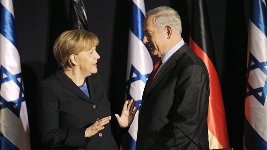 Israel's Prime Minister Benjamin Netanyahu (R) stands next to German Chancellor Angela Merkel after their joint news conference in Jerusalem February 25, 2014. Germany views Iran as a potential threat not just to Israel, but also to European countries, Chancellor Angela Merkel said on Tuesday. REUTERS/Ammar Awad    (JERUSALEM - Tags: POLITICS) - RTR3FPD4