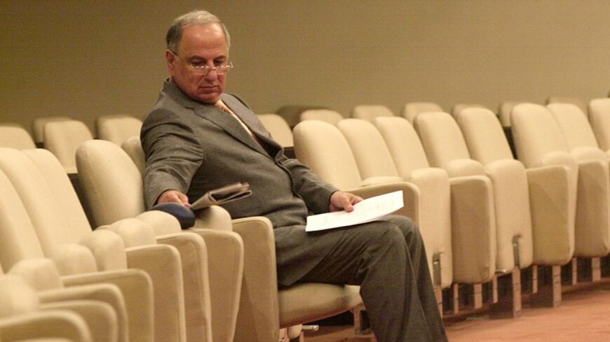 Chalabi, head of the Iraqi National Congress, waits for a meeting of the Iraqi National Council to recommence in Baghdad.  Ahmed Chalabi, head of the Iraqi National Congress, waits for a meeting of the Iraqi National Council to recommence in Baghdad September 4, 2004. An Iraqi Islamist group has said it tried to assassinate Iraqi politician Ahmed Chalabi this week and that four men died in the attack, Al Jazeera television said on Saturday. REUTERS/Samir Mizban/Pool - RTR9YVG