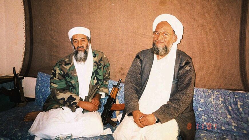 CAPTION CORRECTION - CORRECTING IDENTIFICATION IN HEADLINE

Osama bin Laden (L) sits with his adviser Ayman al-Zawahiri, an
Egyptian linked to the al Qaeda network, during an interview with
Pakistani journalist Hamid Mir (not pictured) in an image supplied by
the respected Dawn newspaper November 10, 2001. In the article, which
was published on Saturday in Karachi, bin Laden said he had nuclear and
chemical weapons and might use them in response to U.S. attacks. Mir
told Reuters he held the two-hour intervi
