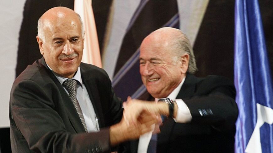 FIFA President Sepp Blatter (R) and Palestinian FA chairman Jibril Rajoub attend a ceremony awarding Blatter an honorary Doctorate degree at An Najah National University in the West Bank city of Nablus July 7, 2013. Blatter is on a four-day journey to Jordan, the Palestinian Territories and Israel. REUTERS/Abed Omar Qusini (WEST BANK - Tags: SPORT SOCCER POLITICS EDUCATION) - RTX11FJ2