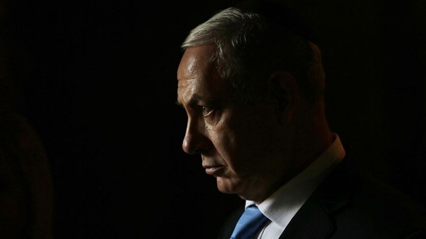 Israel's Prime Minister Benjamin Netanyahu leaves after attending a ceremony with Canada's Prime Minister Stephen Harper in the Hall of Remembrance at the Yad Vashem Holocaust memorial in Jerusalem January 21, 2014. Harper told Israel's parliament on Monday any comparison between the Jewish state and apartheid South Africa was "sickening", drawing a standing ovation - and an angry walkout by two Arab legislators. REUTERS/Baz Ratner (JERUSALEM - Tags: POLITICS) - RTX17O8X