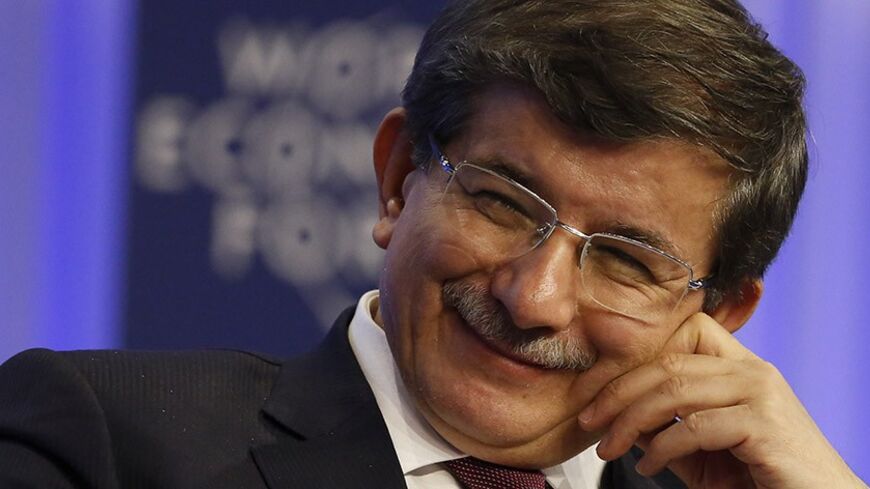 Turkish Foreign Minister Ahmet Davutoglu attends a session at the annual meeting of the World Economic Forum (WEF) in Davos January 24, 2014.                     REUTERS/Ruben Sprich (SWITZERLAND  - Tags: POLITICS BUSINESS)   - RTX17SM8
