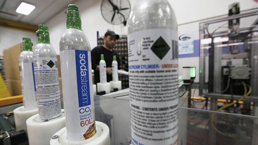 Carbonator bottles are seen at the SodaStream factory in the West Bank Jewish settlement of Maale Adumim January 28, 2014. Appliance maker SodaStream International Ltd scored big in nabbing A-list actress Scarlett Johansson as its global brand ambassador in time for this year's Super Bowl advertising bonanza. But the limelight can be harsh. While the multi-million dollar deal may have increased brand awareness, it also strengthened calls for a boycott of the Israel-based company, whose main factory lies in 