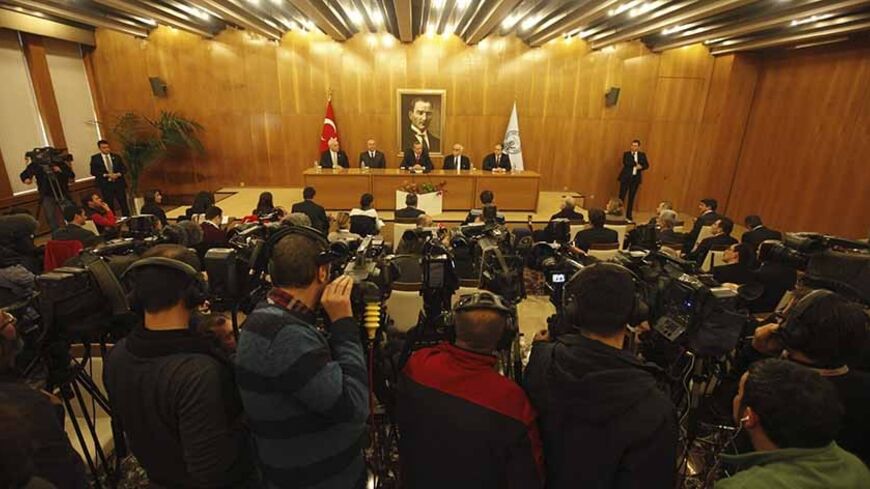 Cameramen film a news conference by Turkey's Prime Minister Tayyip Erdogan in Istanbul February 3, 2014. Dozens of their colleagues are in prison or on trial, thousands of faceless opponents hound them on Twitter, and phone calls from government officials warn them over their coverage - all hazards of the trade for Turkey's journalists. Government critics who refuse to be muzzled can find themselves sacked. Others avoid trouble, such as the broadcaster which screened a documentary on penguins last June whil