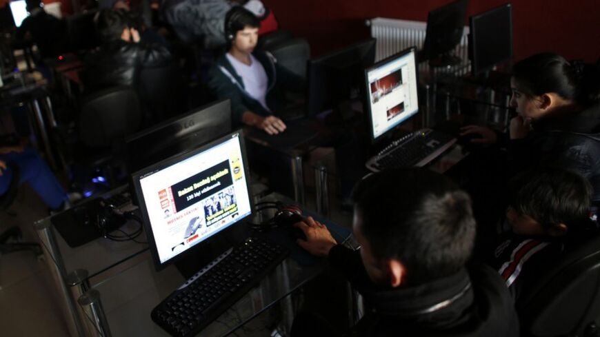 People use computers at an internet cafe in Ankara February 6, 2014. Turkey's parliament, where Prime Minister Tayyip Erdogan's AK Party has a majority, has approved internet controls enabling web pages to be blocked within hours in what the opposition decried as part of a government bid to stifle a corruption scandal with methods more suitable to "times of coups". Under a bill passed late on Wednesday, telecommunications authorities can block access to material within four hours without a prior court order