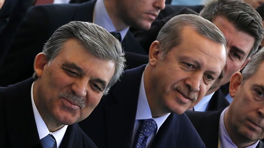 Turkish President Abdullah Gul (L) and Prime Minister Tayyip Erdogan arrive at an opening ceremony of a new line of the Ankara Metro in Ankara February 12, 2014. REUTERS/Umit Bektas (TURKEY - Tags: POLITICS) - RTX18NXZ