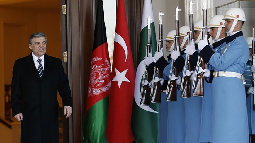 Turkish President Abdullah Gul waits for his guests at the Turkey-Afghanistan-Pakistan Trilateral Summit at the Presidential Palace in Ankara February 13, 2014. REUTERS/Umit Bektas (TURKEY - Tags: POLITICS) - RTX18PWR