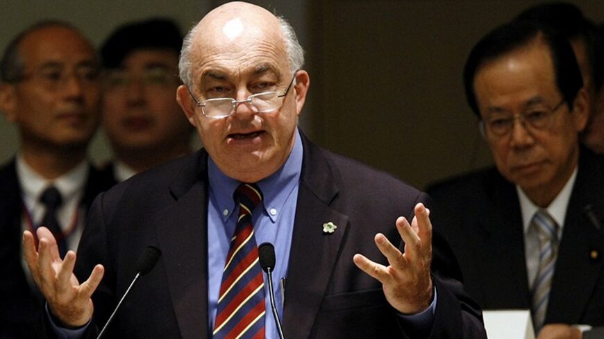 Kemal Dervis, administrator of the United Nations Development Programme (UNDP), delivers a speech as Japanese Prime Minister Yasuo Fukuda (R) listens at the closing session of the Fourth Tokyo International Conference on African Development (TICAD) in Yokohama, south of Tokyo, May 30, 2008.   REUTERS/Franck Robichon/Pool (JAPAN) - RTX6BA7