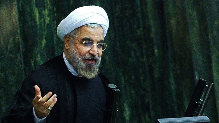 A picture obtained from Iran's ISNA news agency shows Iranian President Hassan Rouhani speaking during an open session in the parliament in Tehran on November 10, 2013. Rouhani said Iran will not abandon its nuclear rights, including uranium enrichment, media reported a day after a fresh round of talks with world powers. AFP PHOTO/ ISNA / BORNA GHASEMI        (Photo credit should read BORNA GHASEMI/AFP/Getty Images)