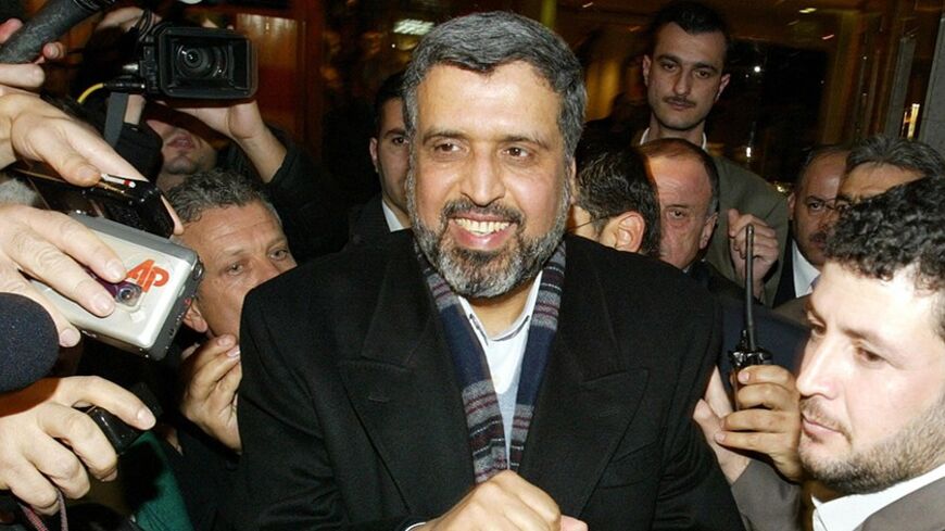 Damascus, SYRIA:  Ramadan Abdullah Shalah, the Secretary General of the Palestinian Islamic Jihad, is escorted by his bodyguards as he walks past journalists following his meeting with Palestinian leader Mahmud Abbas in Damascus late 20 January 2007. Abbas is in Syria for talks with Syrian leaders and Palestinian militants aimed at ending a deadly battle for power with the rival Hamas party. The moderate Abbas held talks with Syrian President Bashar al-Assad during his trip and could also hold a highly-anti