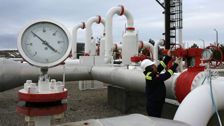 A worker checks the valve gears in a natural gas control centre of Turkey's Petroleum and Pipeline Corporation, 35 km (22 miles) west of Ankara, January 5, 2009. The European Union on Monday scheduled talks with Russia to press for a speedy resolution of a dispute with Ukraine that has hit gas supplies to countries in eastern and southern Europe facing freezing temperatures. Turkey has increased gas delivered direct from Russia via the Blue-Stream pipeline under the Black Sea to compensate for a slight decl