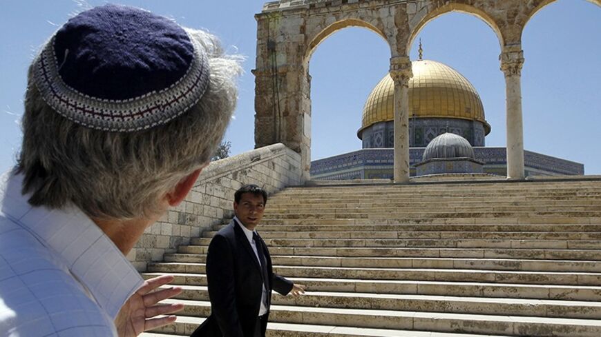 Israeli lawmaker Danny Danon (R) stands in front of the Dome of the Rock on the compound known to Muslims as al-Haram al-Sharif and to Jews as Temple Mount, in Jerusalem's Old City July 20, 2010. Danon, a lawmaker of Prime Minister Benjamin Netanyahu's right-wing party, on Tuesday visited the flashpoint religious site in Jerusalem revered by Jews and Muslims, a move that has sparked violence in the past. REUTERS/Ammar Awad (JERUSALEM - Tags: POLITICS RELIGION) - RTR2GKIE
