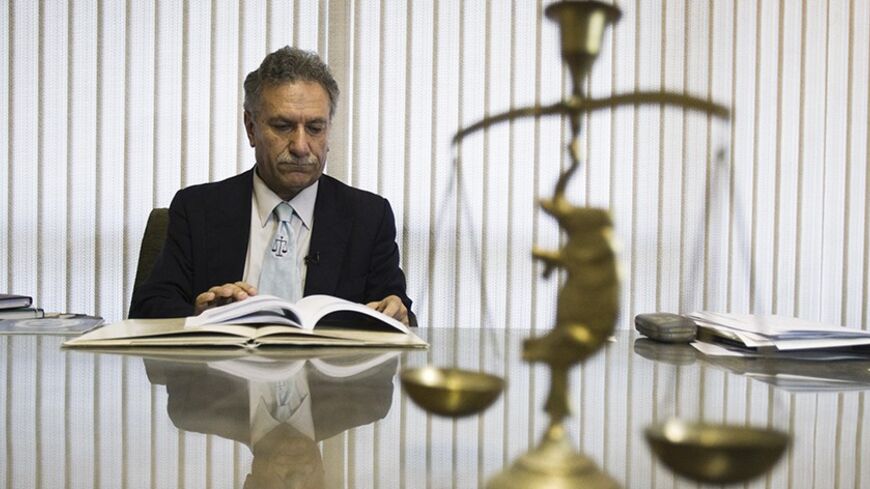 EDITORS' NOTE: Reuters and other foreign media are subject to Iranian restrictions on their ability to film or take pictures in Tehran.
Mohammad Ali Dadkhah, lawyer of Yousef Nadarkhani who was sentenced to death for apostasy, is interviewed by Reuters in his office in Tehran October 3, 2011. REUTERS/Raheb Homavandi  (IRAN - Tags: CRIME LAW POLITICS RELIGION TPX IMAGES OF THE DAY) - RTR2S62X