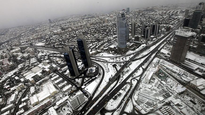 Istanbul's financial district, Levent district, which comprises of leading Turkish companies' headquarters and popular shopping malls, is seen from the observation deck of Sapphire Tower in Istanbul January 30, 2012. The 261 metres high (285.4 yards) Sapphire Tower of Istanbul is the country's highest building. Picture was taken through glass. REUTERS/Murad Sezer (TURKEY - Tags: CITYSPACE BUSINESS) - RTR2X2RP