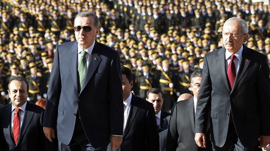 Turkey's Prime Minister Tayyip Erdogan (2nd R) and leader of the main opposition Republican People's Party (CHP) Kemal Kilicdaroglu (R) attend an official ceremony to mark the 89th anniversary of Republic Day at Anitkabir in Ankara October 29, 2012. Anitkabir is the mausoleum of Mustafa Kemal Ataturk, founder of secular Turkey. REUTERS/Umit Bektas (TURKEY - Tags: POLITICS) - RTR39QHB
