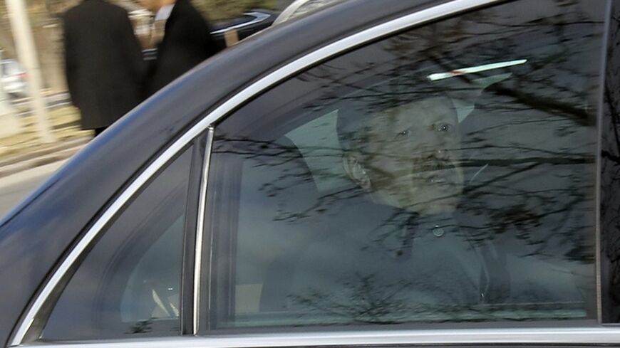 Turkey's Prime Minister Tayyip Erdogan arrives for the National Security Council meeting in his car at the Presidential Palace in Ankara February 26, 2014. Erdogan accused his enemies on Tuesday of hacking encrypted state communications to fake a phone conversation suggesting he warned his son to hide large sums of money before police raids as part of the inquiry.    REUTERS/Stringer (TURKEY - Tags: POLITICS CIVIL UNREST) - RTR3FQKO