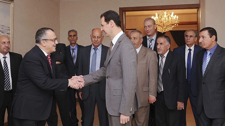 Syria's President Bashar al-Assad (C) welcomes a delegation from the Jordanian Foreign Affairs Council for Regulating Popular Diplomacy before a meeting in Damascus March 4, 2014, in this handout photograph released by Syria's national news agency SANA.     REUTERS/SANA/Handout via Reuters (SYRIA - Tags: POLITICS CONFLICT CIVIL UNREST) ATTENTION EDITORS – THIS IMAGE WAS PROVIDED BY A THIRD PARTY. FOR EDITORIAL USE ONLY. NOT FOR SALE FOR MARKETING OR ADVERTISING CAMPAIGNS. THIS PICTURE IS DISTRIBUTED EXACTLY