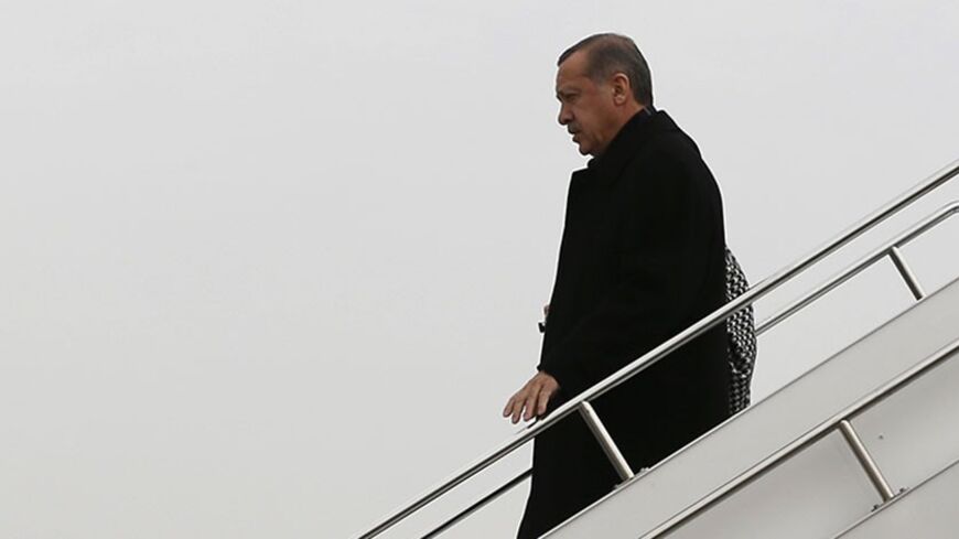 Turkey's Prime Minister Tayyip Erdogan steps off from his plane as he arrives in Elazig for an election rally of his ruling AK Party March 6, 2014. Turkey will hold municipal elections on March 30. REUTERS/Umit Bektas (TURKEY - Tags: POLITICS ELECTIONS) - RTR3G4AH