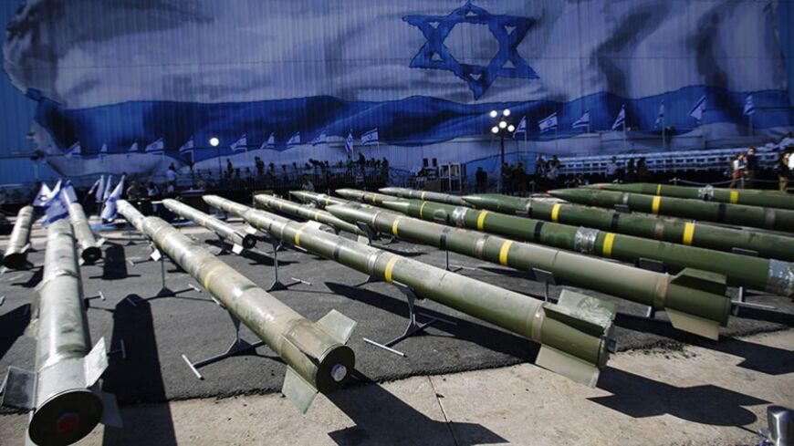 M302 rockets found aboard the Klos C ship are displayed at an Israeli  navy base in the Red Sea resort city of Eilat March 10, 2014. The ship seized by the Israeli navy on suspicion of smuggling arms from Iran to the Gaza Strip docked on Saturday in Israel, which planned to put the cargo on display in hope of denting Tehran's rapprochement with the West. REUTERS/Amir Cohen (ISRAEL - Tags: POLITICS MILITARY CIVIL UNREST TPX IMAGES OF THE DAY) - RTR3GG0P