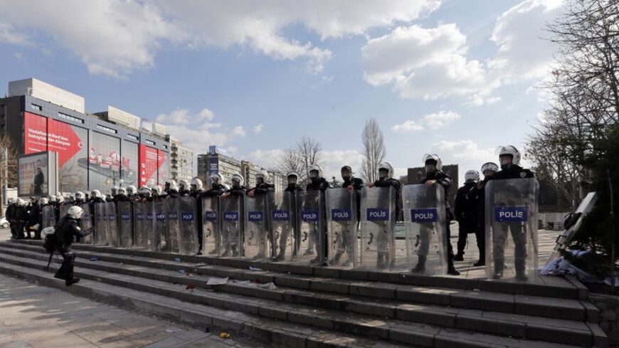 Riot police stand in line as they prepare to disperse demonstrators in Ankara March 12, 2014. Turkish police fired tear gas and water cannon to disperse a crowd of several thousand demonstrators in Ankara's central Kizilay square on Wednesday in a protest triggered by the death of a teenager wounded in street clashes last summer. REUTERS/Umit Bektas (TURKEY  - Tags: POLITICS CIVIL UNREST)   - RTR3GQWV