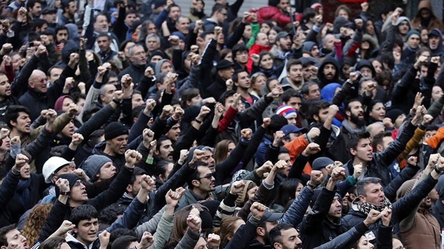 Anti-government protesters shout slogans during a demonstration in Istanbul March 12, 2014. Turkish Prime Minister Tayyip Erdogan criticised protesters who took to the streets of cities across the country in their hundreds of thousands on Wednesday after the funeral of a 15-year-old boy wounded in anti-government clashes last summer.   REUTERS/Murad Sezer (TURKEY  - Tags: POLITICS CIVIL UNREST)   - RTR3GS33