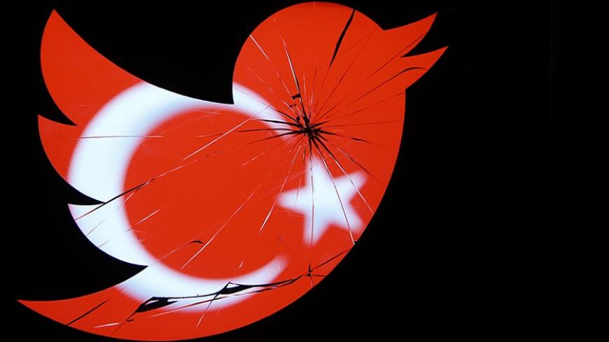 A Turkish national flag is seen through a broken Twitter logo in this photo illustration taken in Zenica, March 21, 2014. Turkey's courts have blocked access to Twitter a little over a week before elections as Prime Minister Tayyip Erdogan battles a corruption scandal that has seen social media awash with alleged evidence of government wrongdoing. The ban came hours after a defiant Erdogan, on the campaign trail ahead of key March 30 local elections, vowed to "wipe out" Twitter and said he did not care what