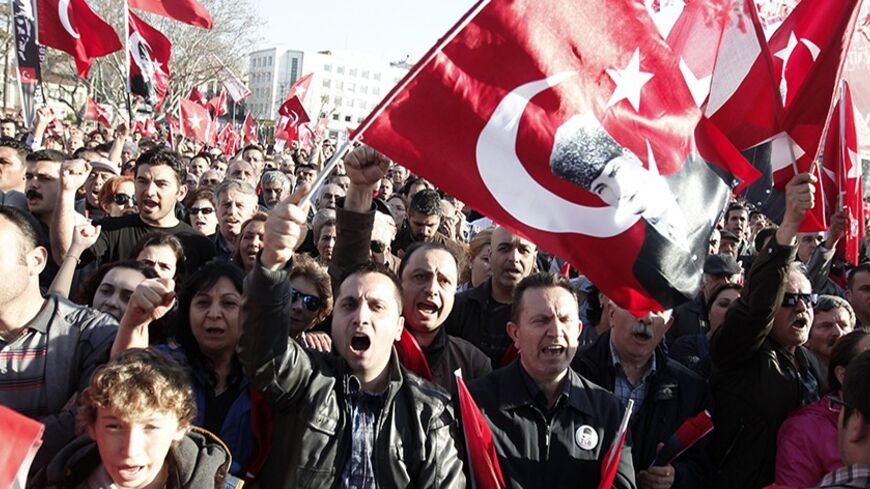 Supporters of Workers' Party shout anti-government slogans during an election rally in Istanbul March 22, 2014. Turkey will hold municipal elections on March 30. REUTERS/Osman Orsal (TURKEY - Tags: POLITICS ELECTIONS) - RTR3I5UX