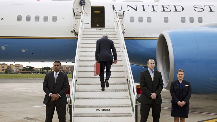 U.S. Secretary of State John Kerry boards his plane to leave Rome, en route to Amman March 26, 2014. Kerry is travelling to Amman, Jordan to meet with Palestinian leader Mahmoud Abbas, according to the State Department. REUTERS/Jacquelyn Martin/Pool (ITALY - Tags: POLITICS) - RTR3IMEH