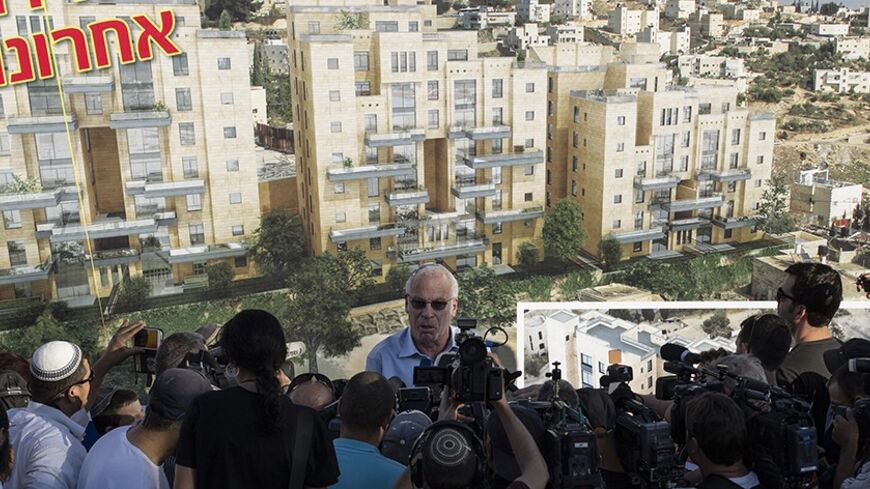 Israeli Housing Minister Uri Ariel speaks to reporters at a ceremony announcing the resumption of construction of an Israeli neighbourhood in East Jerusalem August 11, 2013. Israel moved forward on Sunday with plans to build nearly 1,200 new homes for Jewish settlers holding fast to a defiant settlement policy just days before its expected release of Palestinian prisoners.       REUTERS/Ronen Zvulun (JERUSALEM - Tags: POLITICS) - RTX12HFR