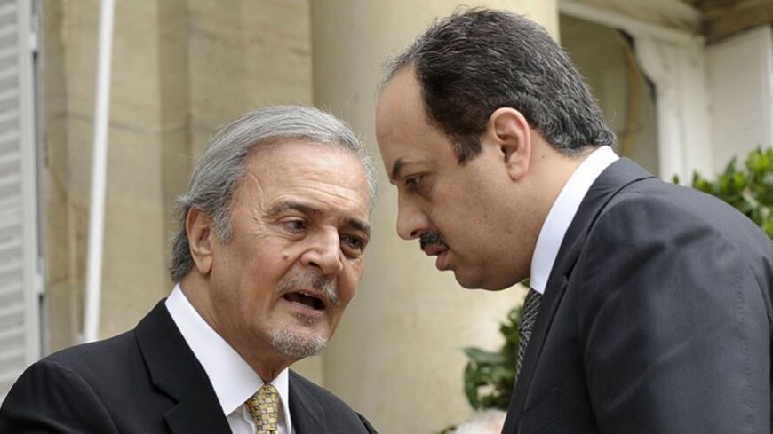 Saudi Foreign Minister Saud al Faisal (L) talks with Qatar Foreign Minister Khalid Al Attiya following their meeting with U.S. Secretary of State John Kerry and members of the Arab Peace Initiative at the United States Embassy in Paris, September 8, 2013. REUTERS/Susan Walsh/Pool (FRANCE - Tags: POLITICS) - RTX13CWG