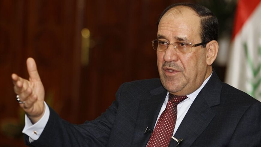 Iraq's Prime Minister Nuri al-Maliki speaks during an interview with Reuters in Baghdad January 12, 2014. Iraqi Prime Minister Nuri al-Maliki, in a striking change of course, is embracing the Sunni Muslim tribal fighters whose role in combating al Qaeda he had allowed to wither after U.S. troops left two years ago. Picture taken January 12, 2014. To match Interview IRAQ/MALIKI   REUTERS/Thaier Al-Sudani (IRAQ - Tags: POLITICS) - RTX17CJT