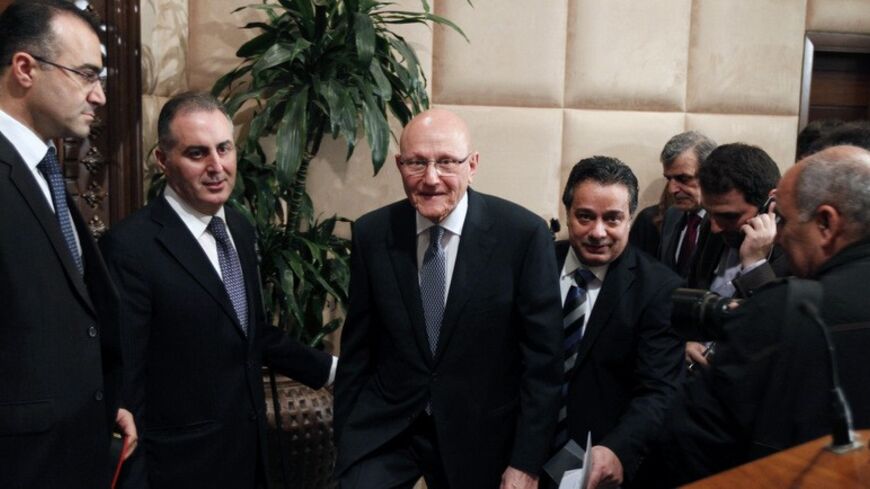 Lebanon's Prime Minister Tammam Salam (C) walks at the presidential palace in Baabda, near Beirut February 15, 2014. Lebanon announced a new government on Saturday, breaking a 10-month political deadlock during which spillover violence from neighbouring Syria worsened internal instability. Parliament designated Sunni lawmaker Salam as prime minister in April 2013, but he had been unable to form a government for months due to rivalries between the Hezbollah-dominated March 8 bloc and the March 14 alliance, l