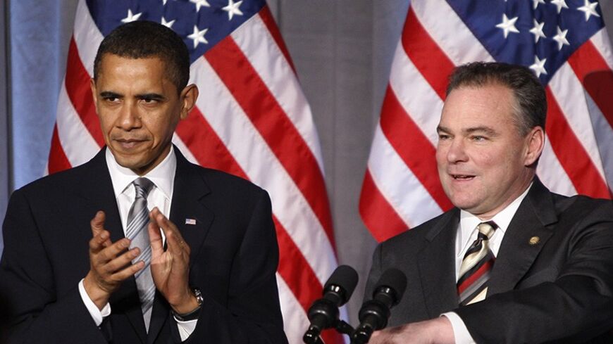 U.S. President Barack Obama applauds alongside Democratic National Committee (DNC) Chairman and Virginia Governor Tim Kaine during a DNC fundraiser in Washington March 25, 2009.      REUTERS/Jason Reed   (UNITED STATES POLITICS) - RTXD7ID
