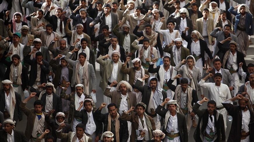 Supporters of the Shi'ite al-Houthi rebel group shout slogans during a demonstration in Sanaa, against the deportation of Yemeni labourers from Saudi Arabia, April 5, 2013. Saudi Arabia has begun deporting thousands of Yemeni labourers following new regulations requiring foreigners to work only for their sponsors, a Yemeni official said on Monday, a move that could "significantly damage" the poor country's economy. Some two million of Yemen's 25 million citizens work abroad, more than half of them in larger
