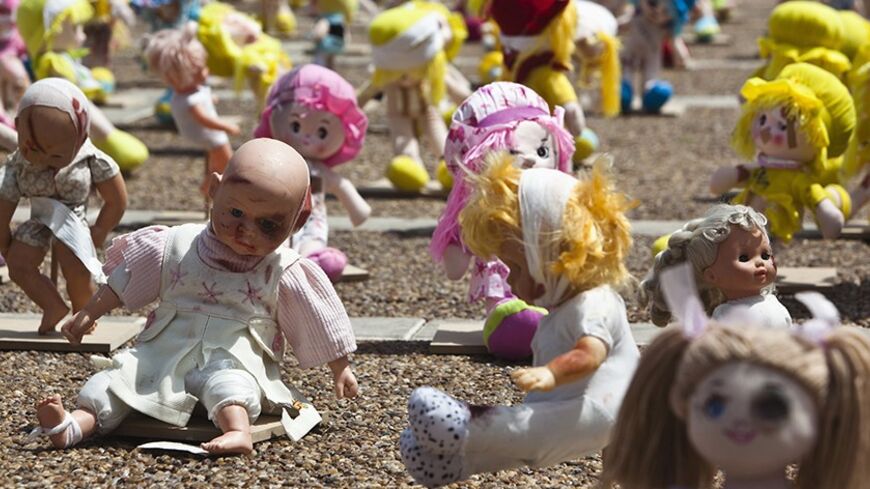 Dolls are displayed in Rabin Square as part of an exhibition to raise awareness of child abuse in Tel Aviv May 24, 2013. Some 1,000 dolls were laid at the square in Israel's commercial capital in a two-day long exhibition organised by a local organisation for the protection of children. REUTERS/Nir Elias (ISRAEL - Tags: SOCIETY) - RTXZZAV